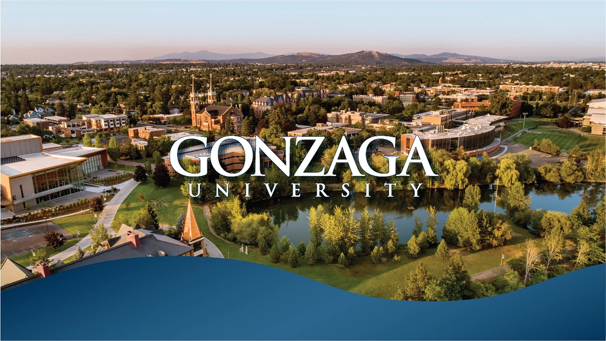 An aerial view of the Gonzaga University campus featuring prominent buildings and lush greenery.
